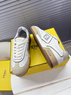 Fendi unisex sneakers with white uppers and tan/brown side panels, lace-up.