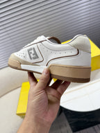 Fendi unisex sneaker heel and lace-up side view, white with tan/brown sole.