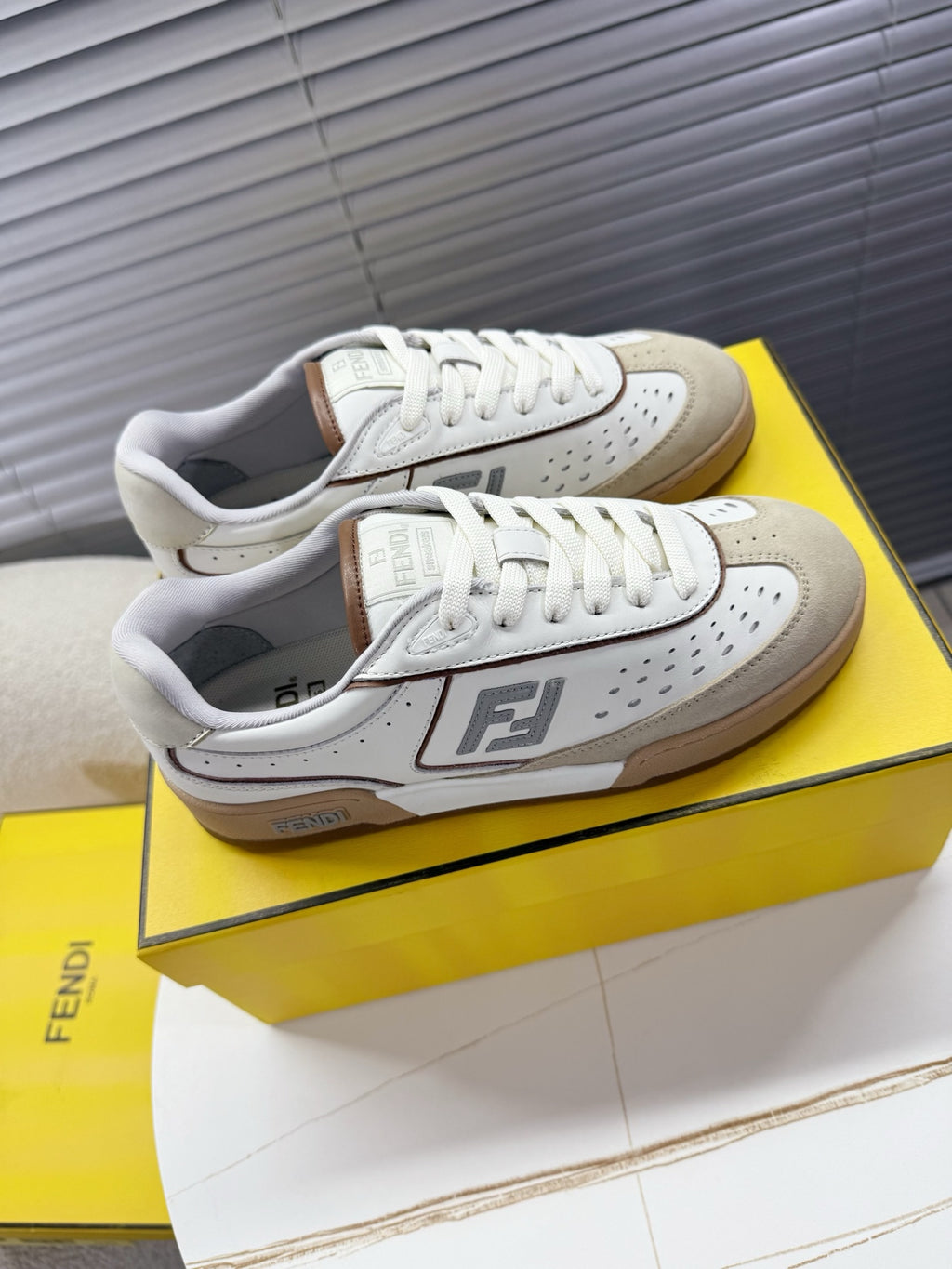 Fendi unisex sneakers in white with tan heel accents, low-profile lace-up.