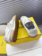 Fendi unisex sneakers showing tan rubber outsoles and open collar, lace-up.