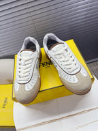 Fendi unisex sneakers in white with beige accents, lace-up with perforated details.