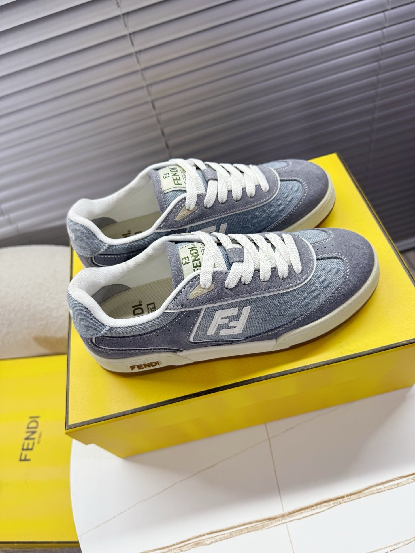 Fendi unisex sneakers, gray uppers and white laces, F logo on side and toe