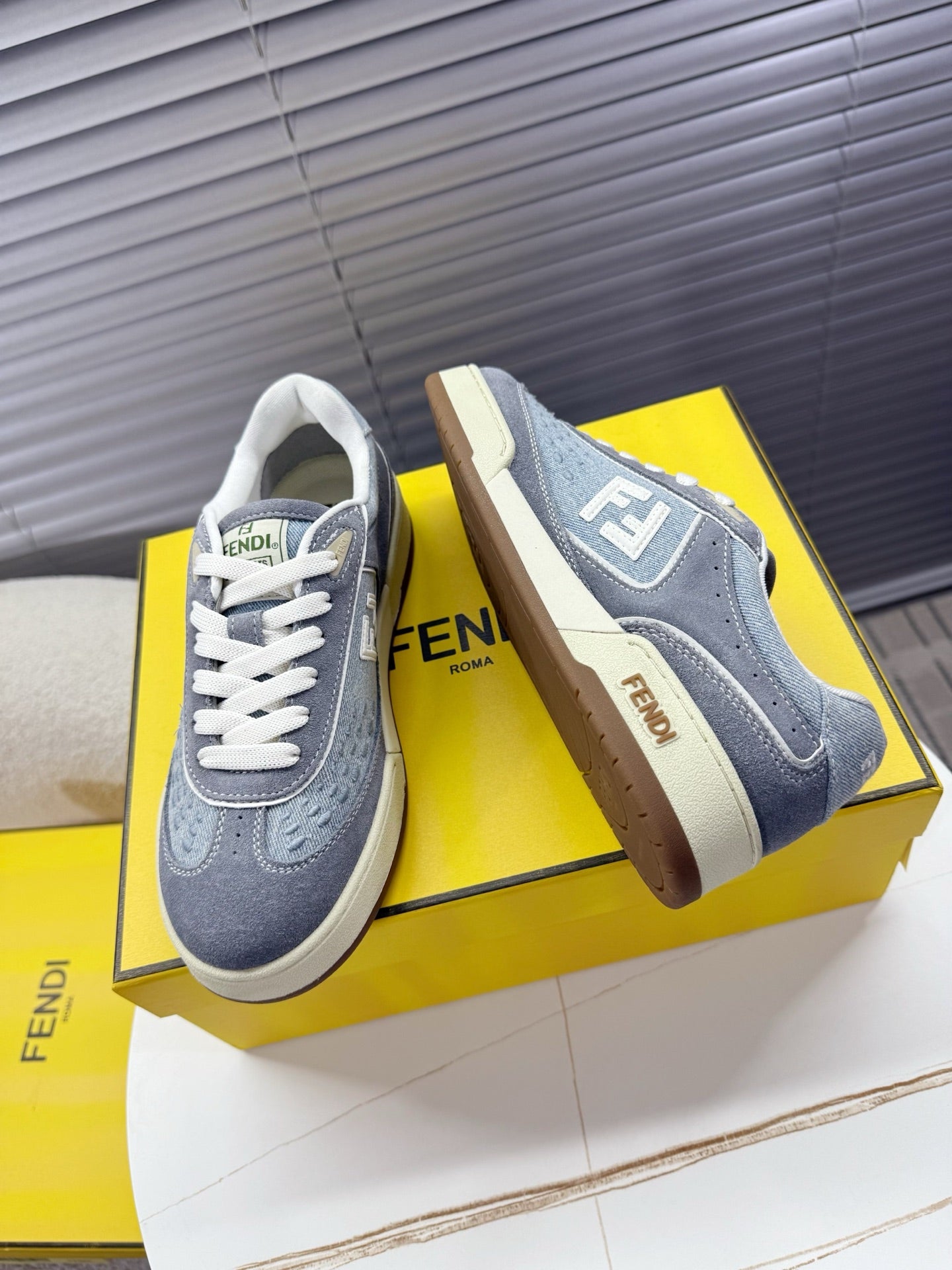 Fendi unisex sneakers, gray uppers with white laces, side FENDI F logo and beige sole
