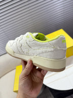 Fendi unisex sneakers: white low-top with neon green collar, textured upper, beige sole