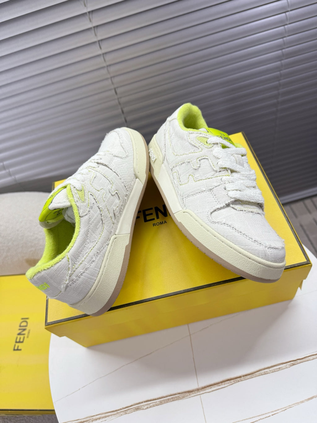 Fendi unisex sneakers: white low-top lace-up with neon green lining, textured upper, beige sole