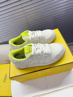 Fendi unisex sneakers: white low-top with neon green collar accents and textured side panels