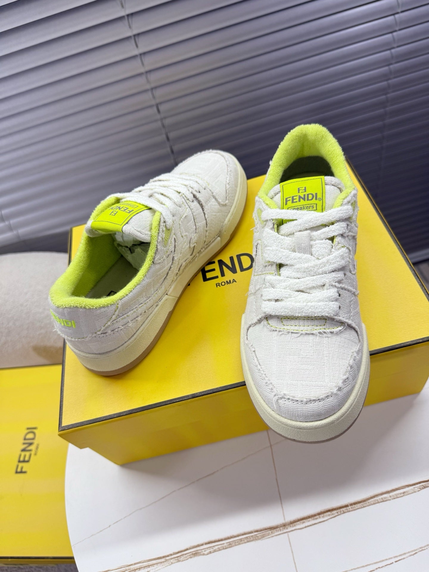 Fendi unisex sneakers: white low-top with neon green collar and tongue Fendi label, beige sole