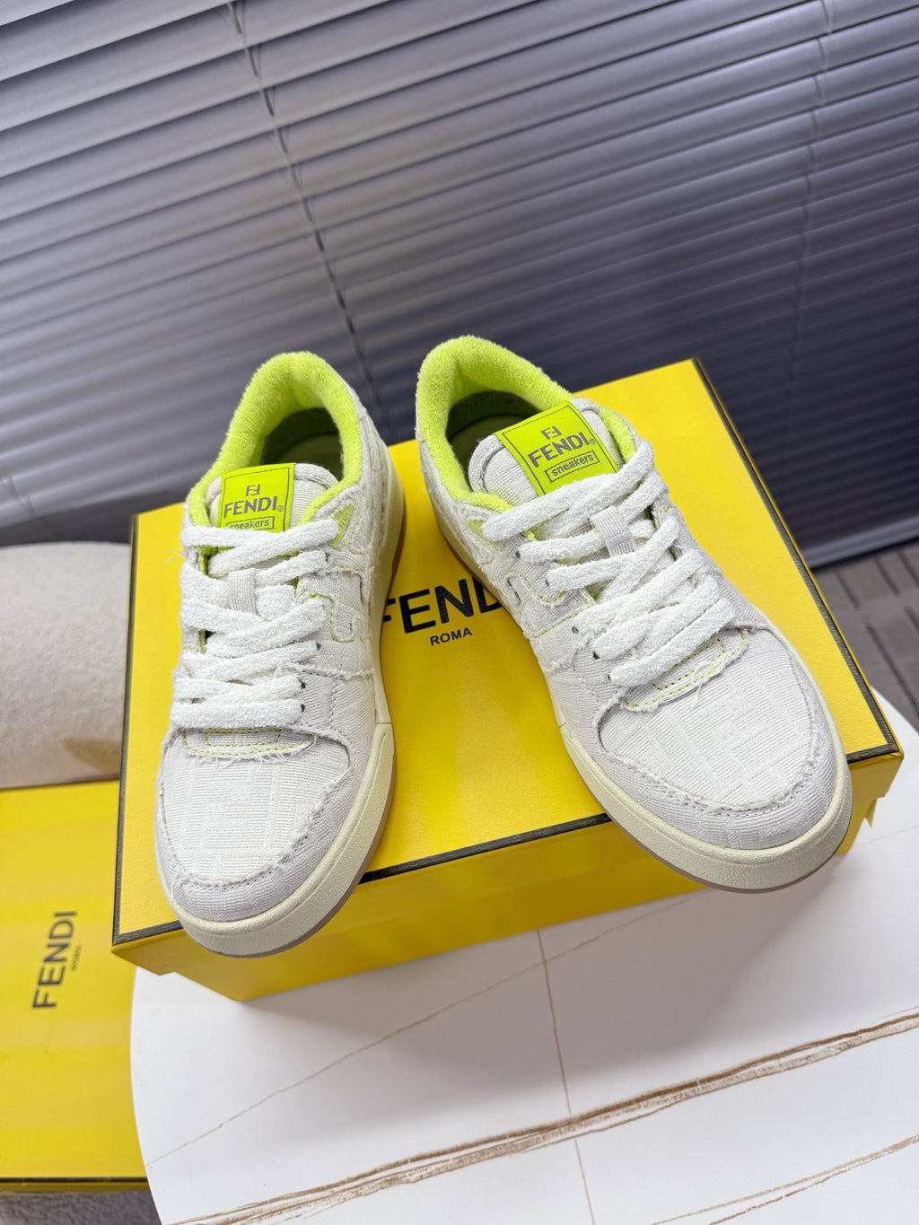 Fendi unisex sneakers: white low-top lace-up with neon green collar and Fendi Roma patch
