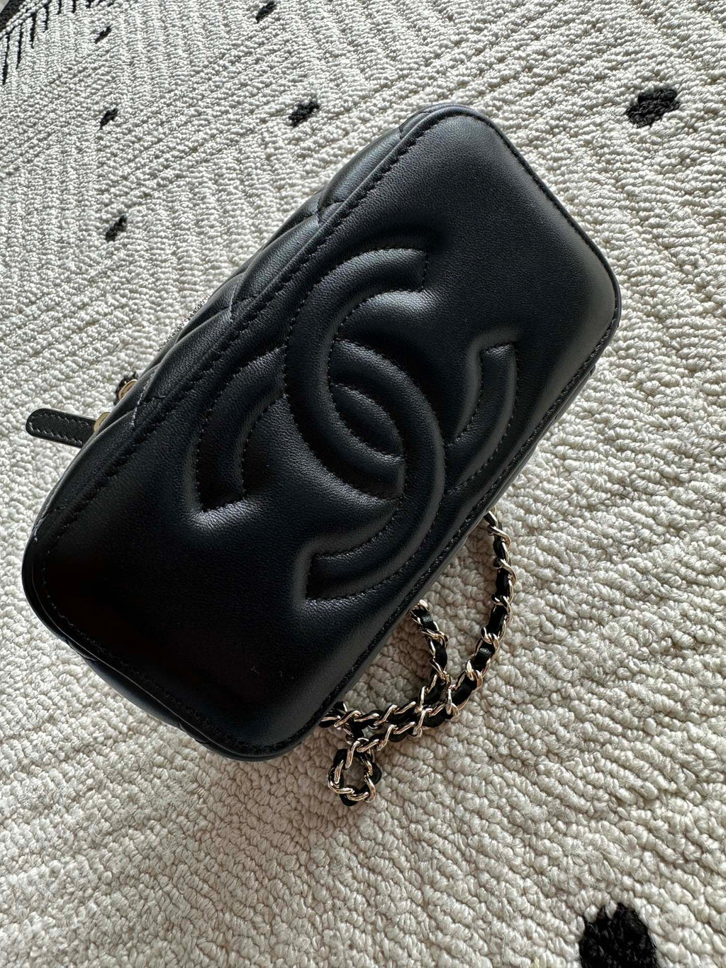 Chanel quilted clutch bag with embossed CC logo, black leather finish