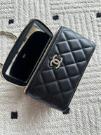 Chanel quilted bag with zipper opening, black interior and card-slot lining