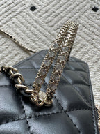 Chanel quilted bag with rhinestone chain strap detail, black leather finish
