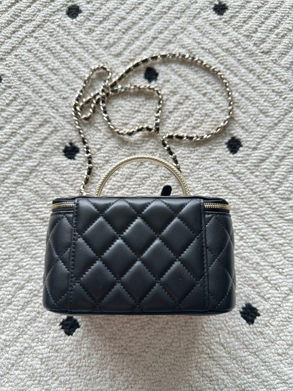 Chanel quilted bag with chain shoulder strap, black stitched diamond pattern