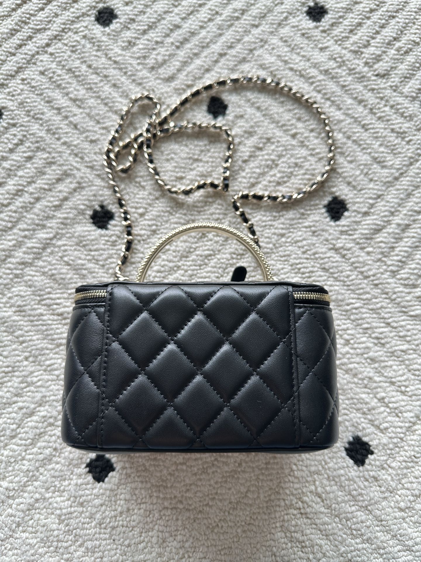 Chanel quilted bag with chain shoulder strap, black stitched diamond pattern