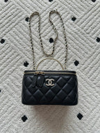 Chanel quilted bag with chain strap, round top handle, black finish