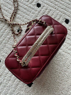 Chanel quilted mini bag, burgundy leather with rhinestone chain strap and top handle