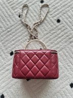 Chanel quilted mini bag with top zip, burgundy leather and hanging chain strap