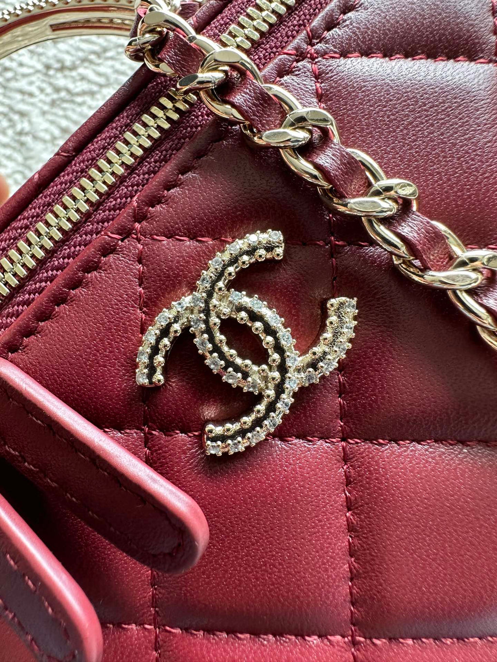 Chanel quilted mini bag zipper detail, burgundy leather with CC emblem