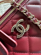 Chanel quilted mini bag zipper detail, burgundy leather with CC emblem