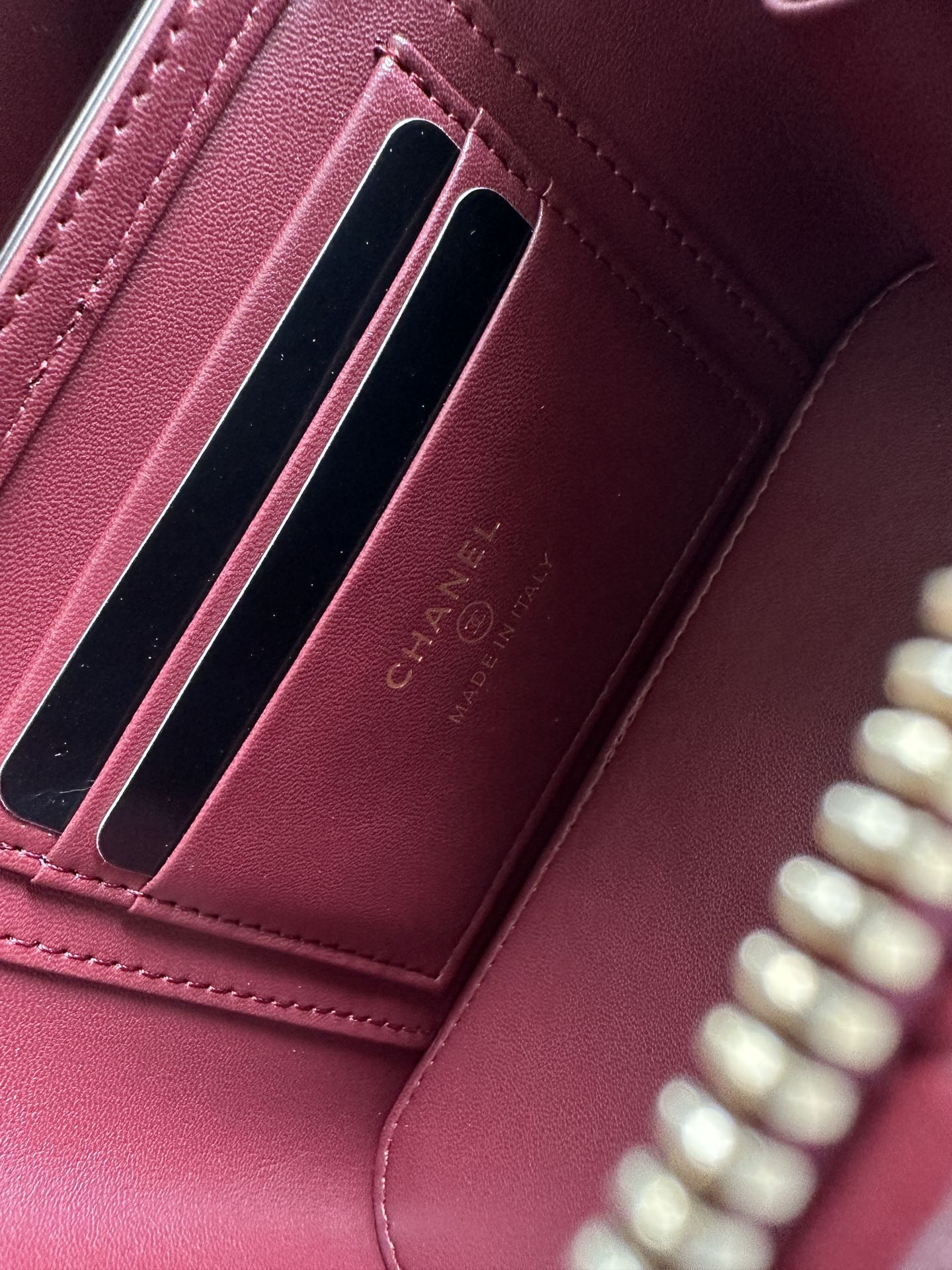 Chanel quilted mini bag card slot, burgundy leather with CHANEL stamped branding