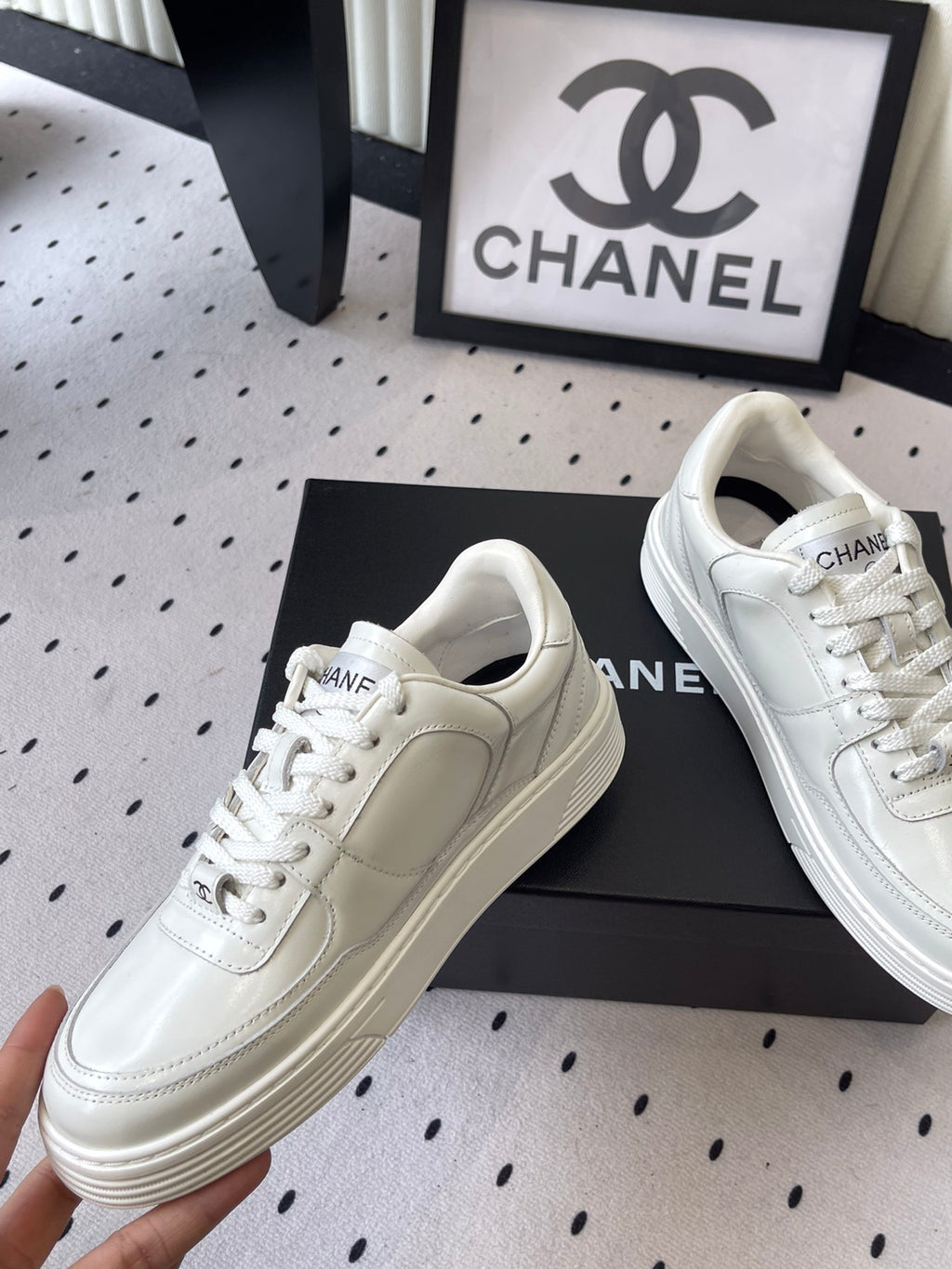 White leather sneakers, lace-up with Chanel CC logo on side and thick sole