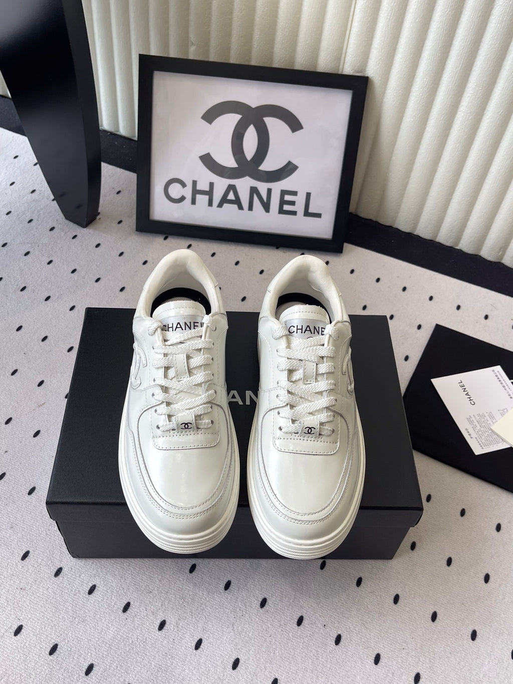 White leather lace-up sneakers with Chanel CC logo, low-top style
