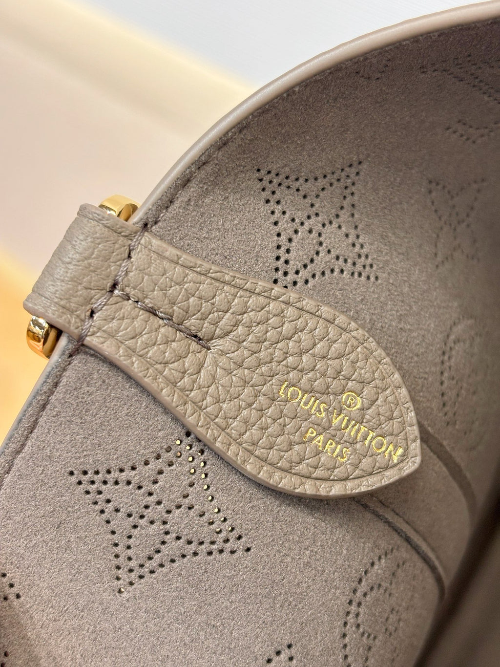 Louis Vuitton gray monogram cosmetic pouch with logo patch and perforated pattern