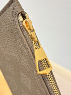 Louis Vuitton gray bag zipper pull with gold-tone lock hardware