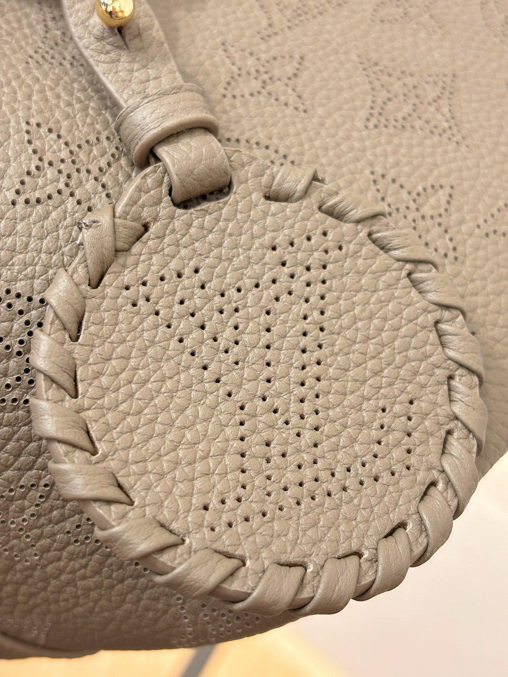 Louis Vuitton gray leather texture with stitched woven trim detail