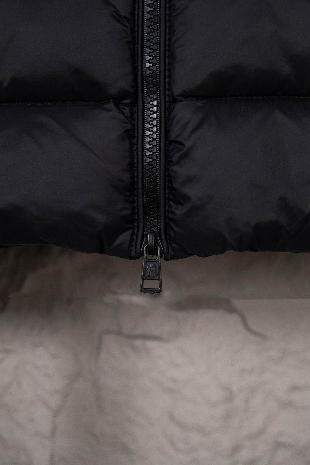 Moncler puffer jacket zipper detail on quilted front panel
