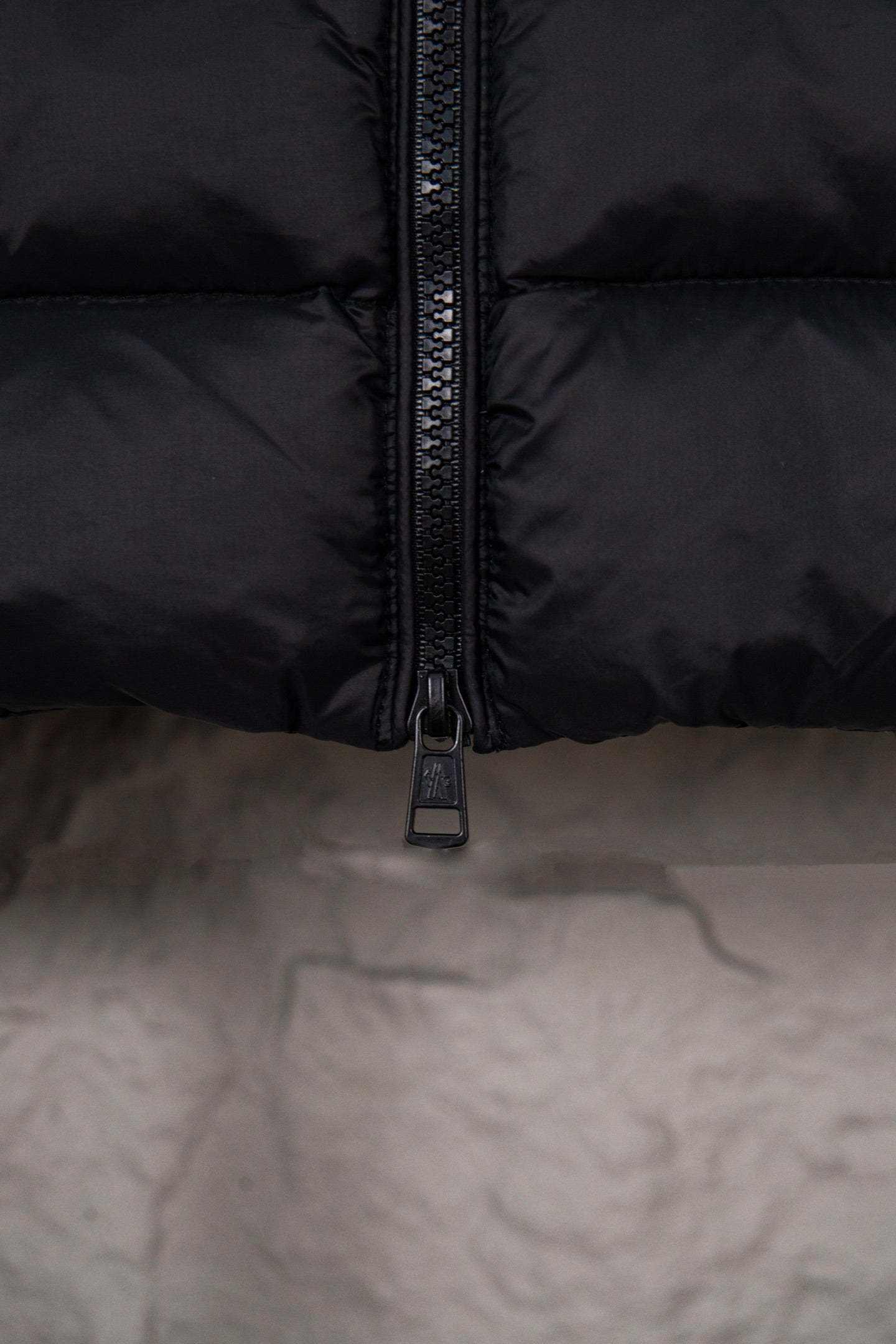 Moncler puffer jacket zipper detail on quilted front panel