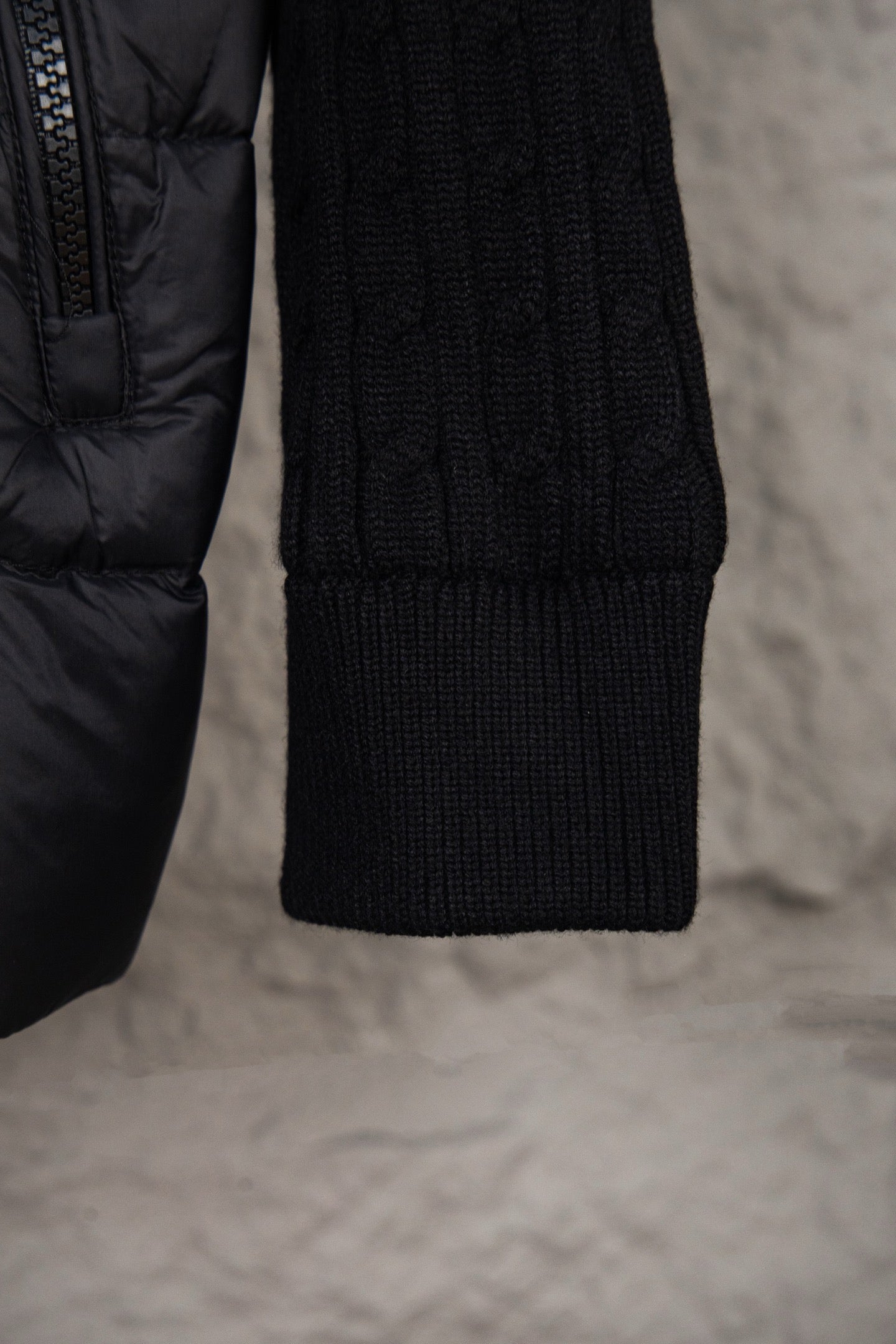 Moncler puffer jacket lower sleeve and knit cuff, dark quilted fabric