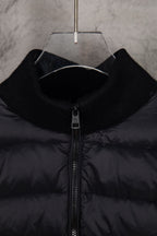 Moncler puffer jacket close-up, black stand collar and central zip
