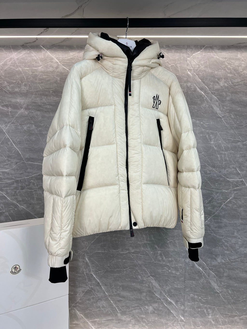 Cream long puffer jacket with hood, front zip, quilted sleeves, flap pockets