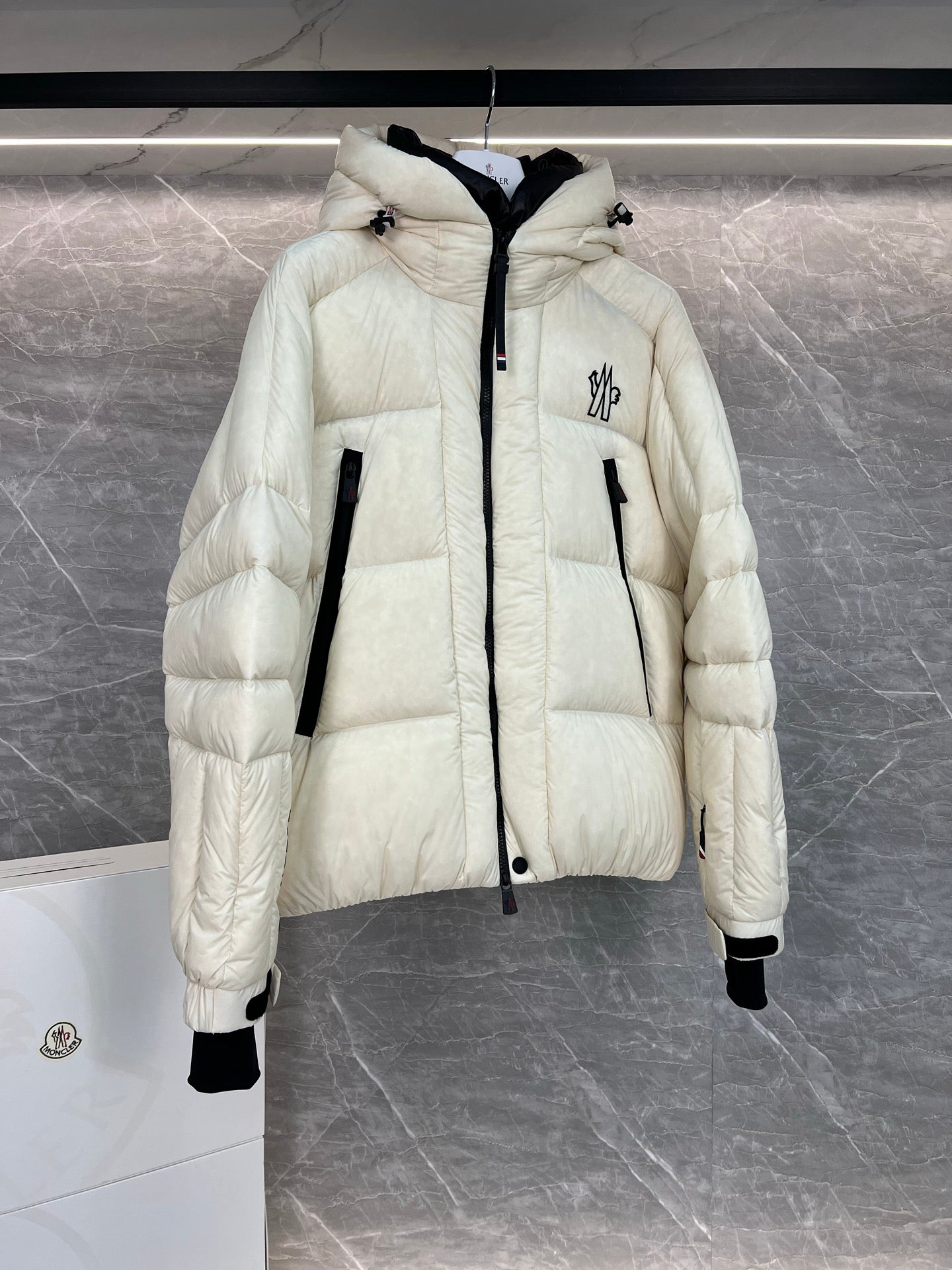 Cream long puffer jacket with hood, front zip, quilted sleeves, flap pockets