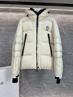 Cream long puffer jacket with hood, front zip, quilted panels, black-trim pockets