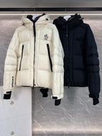 Cream long puffer jacket with hood, front zip, black inner accents, flap pockets
