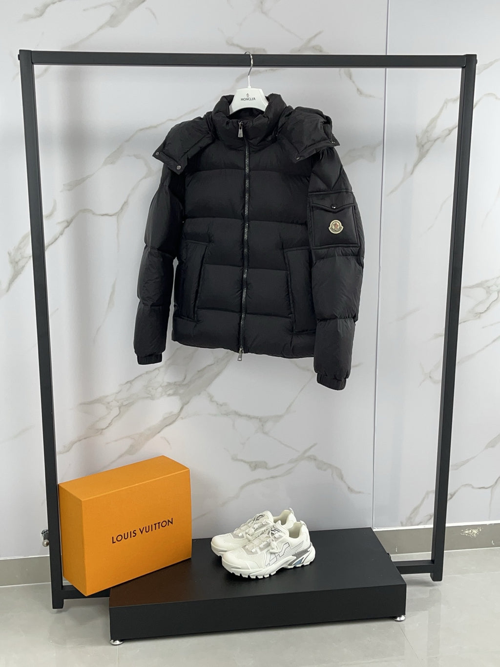Moncler black hooded puffer jacket with zip front and quilted paneling