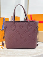 Louis Vuitton monogram tote bag, dark plum, front view with gold-tone hardware