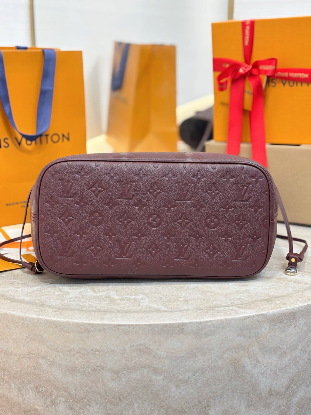 Louis Vuitton monogram crossbody bag in dark plum with top zipper closure