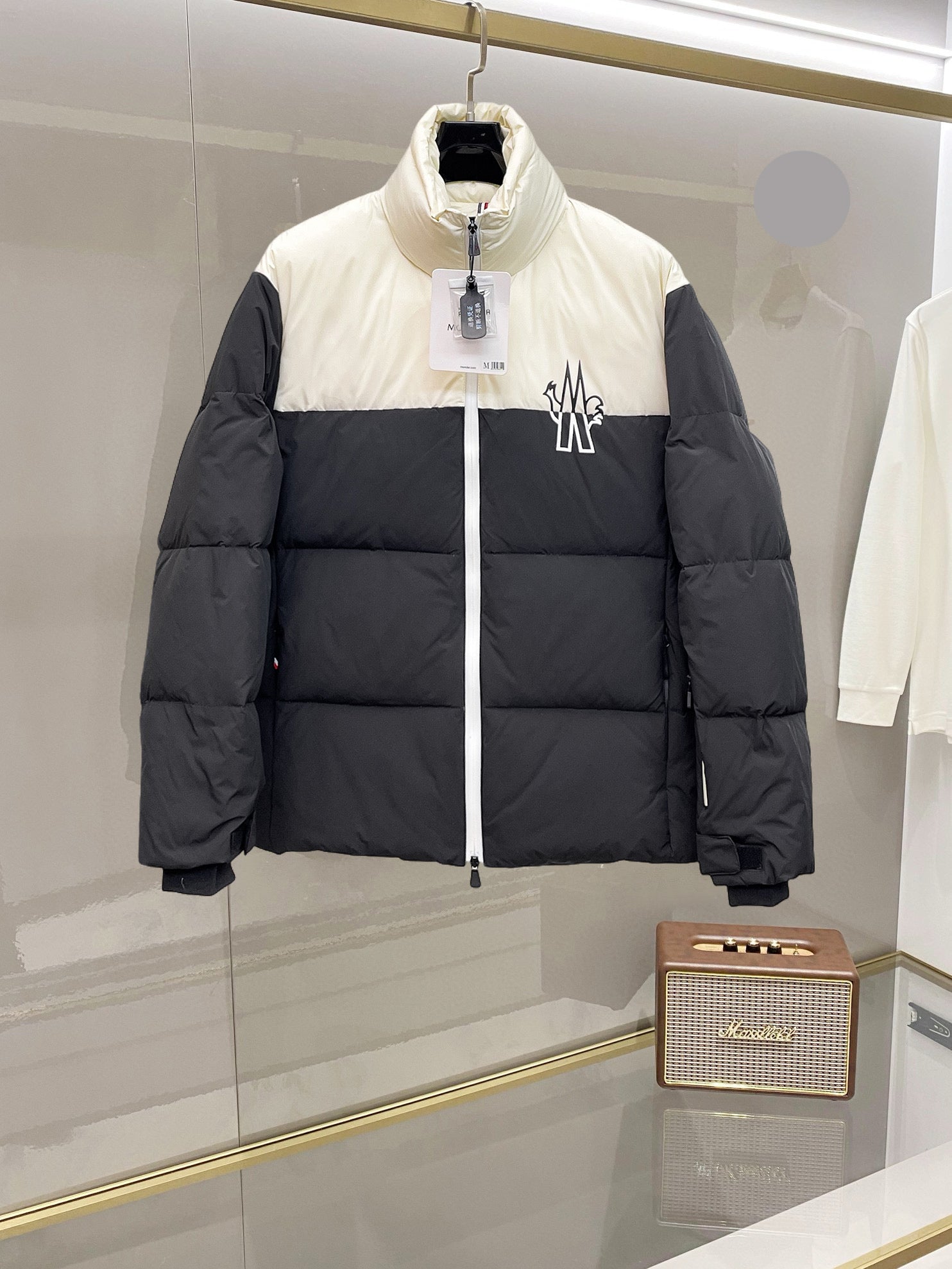 Two-tone puffer jacket with front zipper and Moncler logo, white and dark