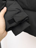 Puffer jacket cuff with knit ribbed lining and snap strap detail