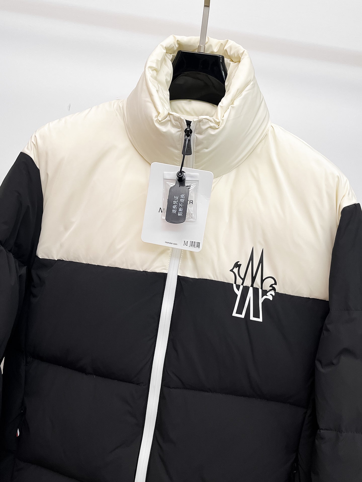 Moncler puffer jacket with front zip and chest logo, white upper and black
