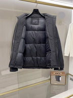 Long black puffer jacket, interior quilt lining visible when open
