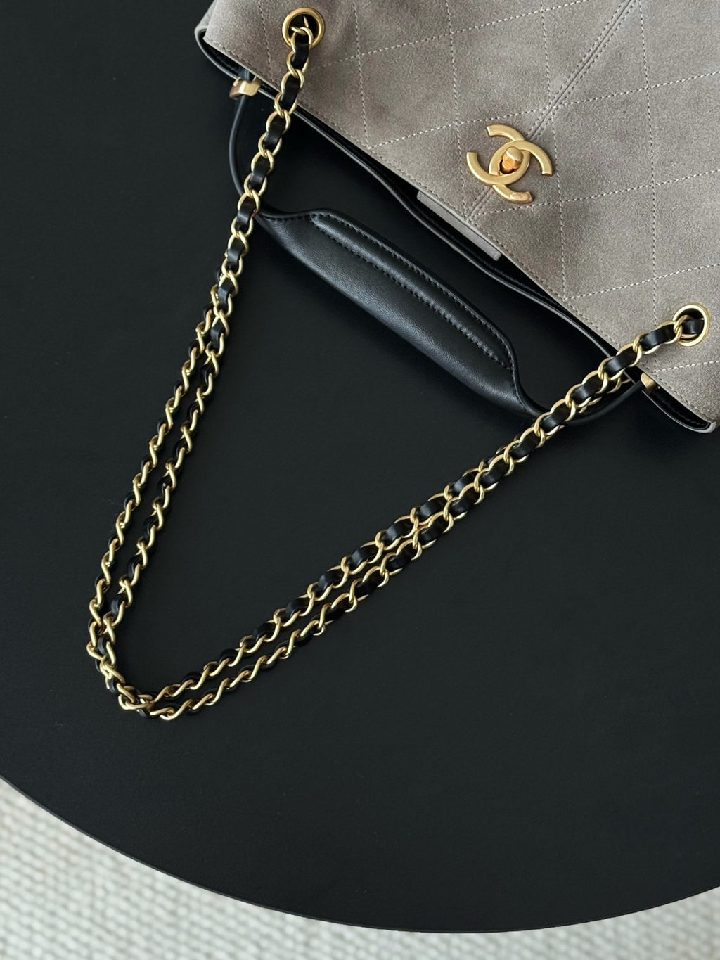 Chanel handbag shoulder strap and interior view, gold-tone chain with logo on front