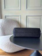 Chanel dark quilted leather shoulder bag with rounded top and smooth handles