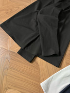 Black polo shirt folded with short sleeves and small chest logo