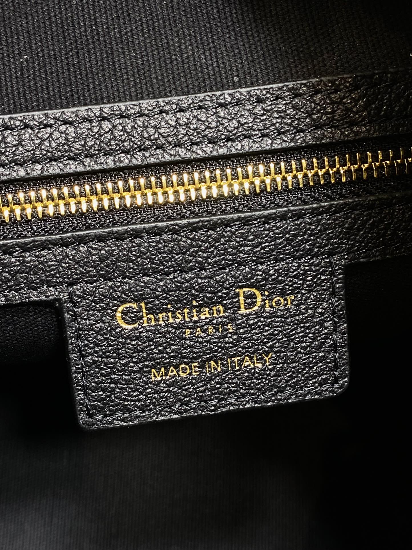 Dior leather bag label reading Christian Dior and Made in Italy