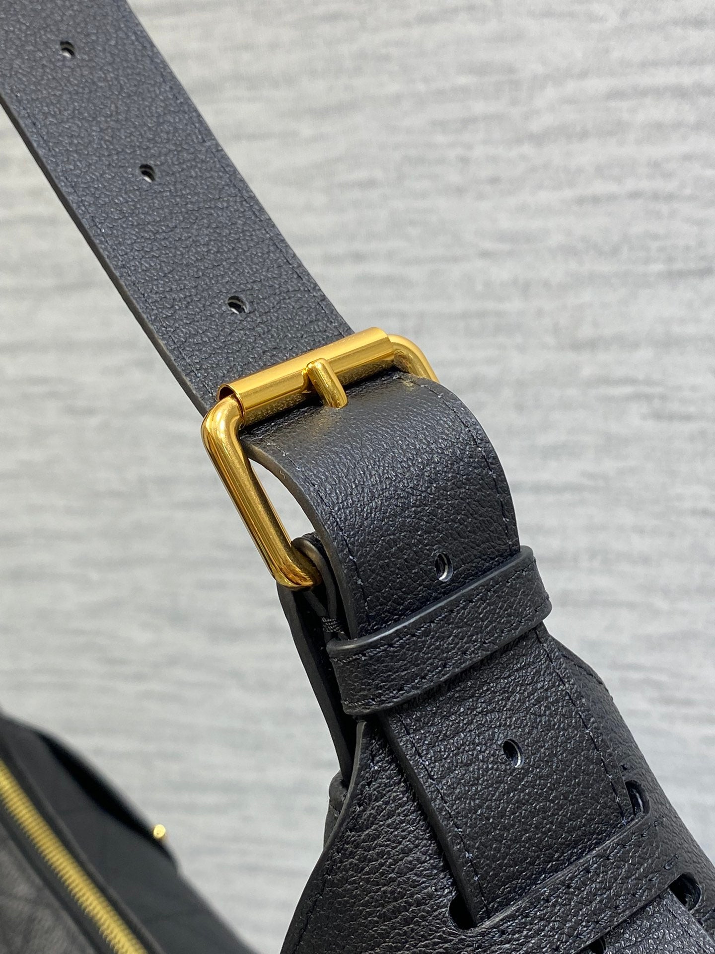 Dior black leather strap with gold-tone buckle and eyelet details