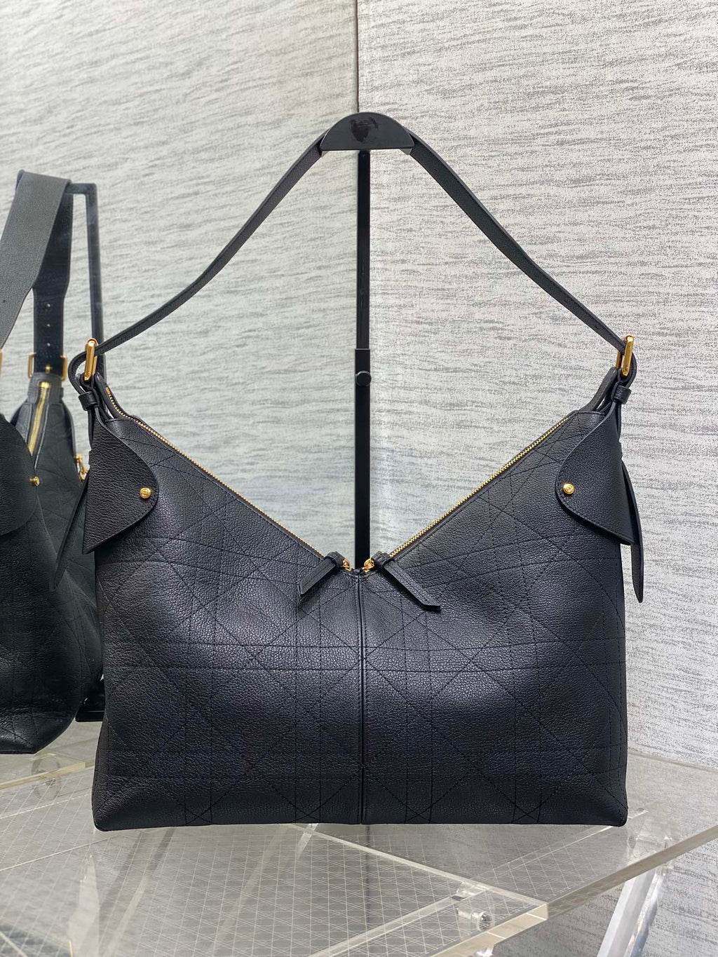 Dior quilted shoulder bag with gold-tone accents and dual short straps