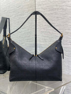 Dior quilted shoulder bag with gold-tone accents and dual short straps